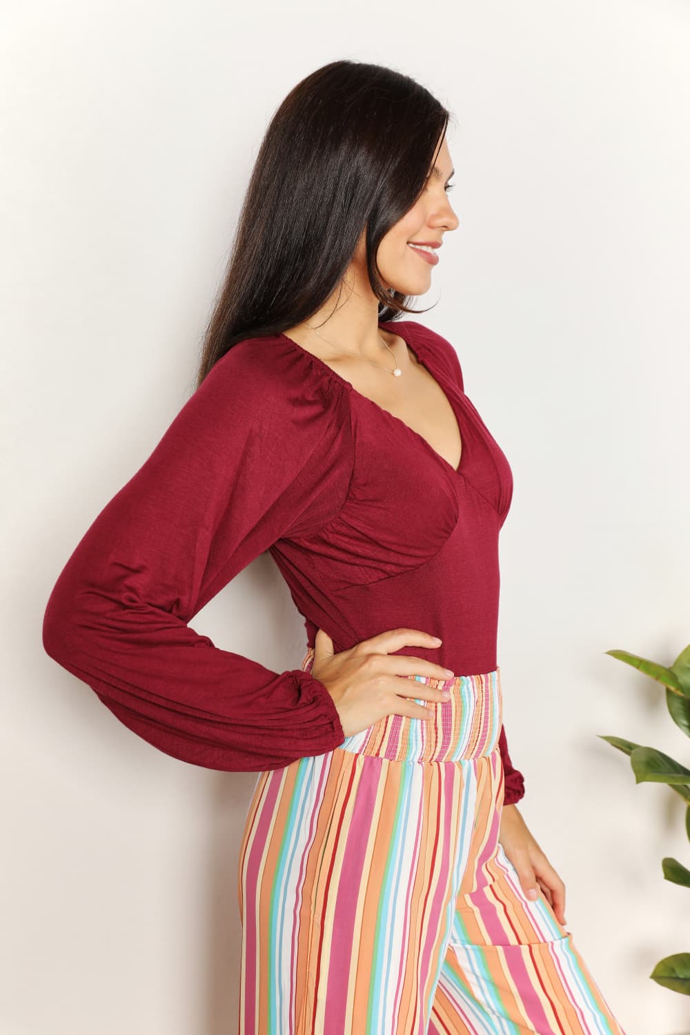 Sophisticated Romance: V-neck Bodysuit with Dramatic Poet Sleeves