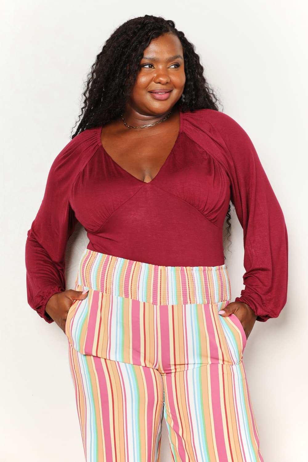 Sophisticated Romance: V-neck Bodysuit with Dramatic Poet Sleeves