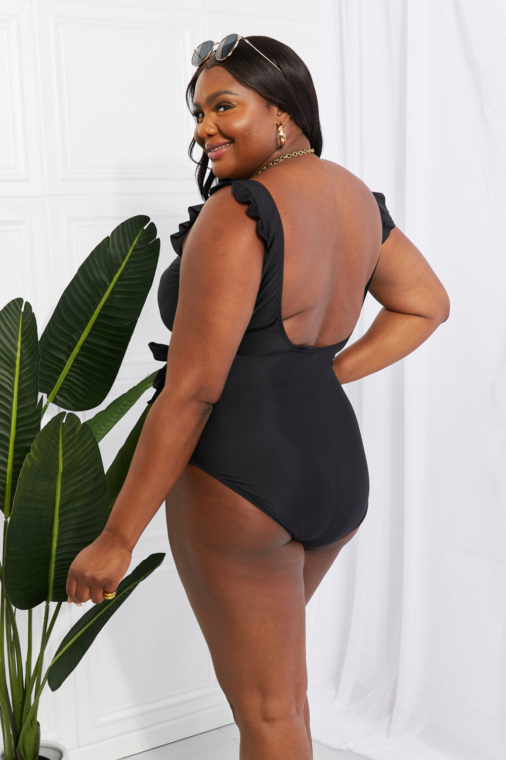 Effortlessly Elegant: Our Black Ruffle Faux Wrap One-Piece Swimsuit
