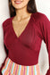 Sophisticated Romance: V-neck Bodysuit with Dramatic Poet Sleeves