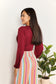 Sophisticated Romance: V-neck Bodysuit with Dramatic Poet Sleeves