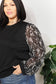 Artful Fusion: Knit Top with Foil-Printed Sleeves